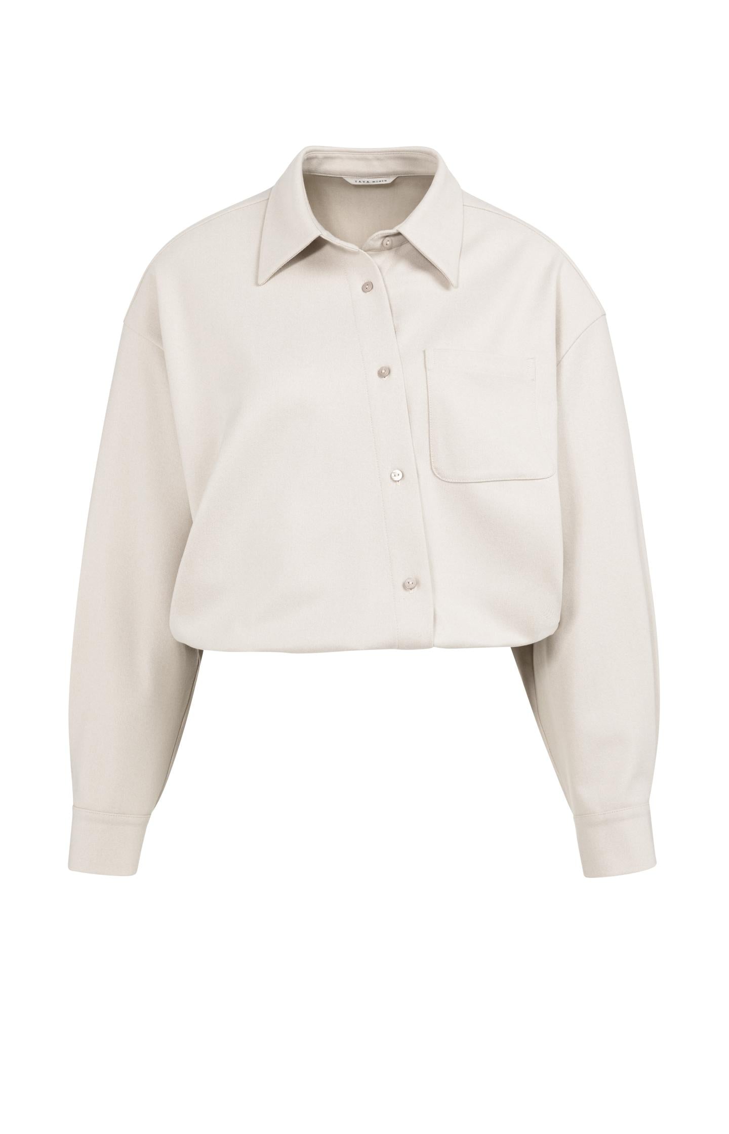 Blouse with asymmetric button placket and elastic hem