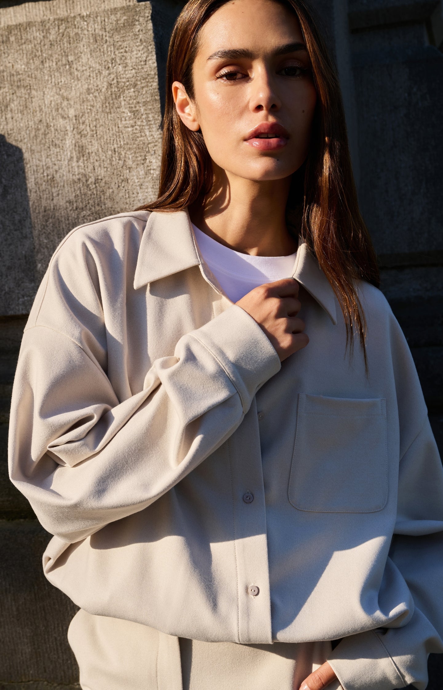 Blouse with asymmetric button placket and elastic hem