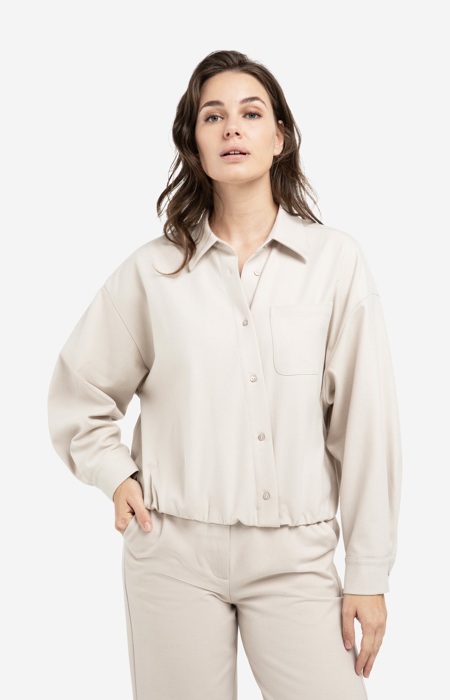 Blouse with asymmetric button placket and elastic hem