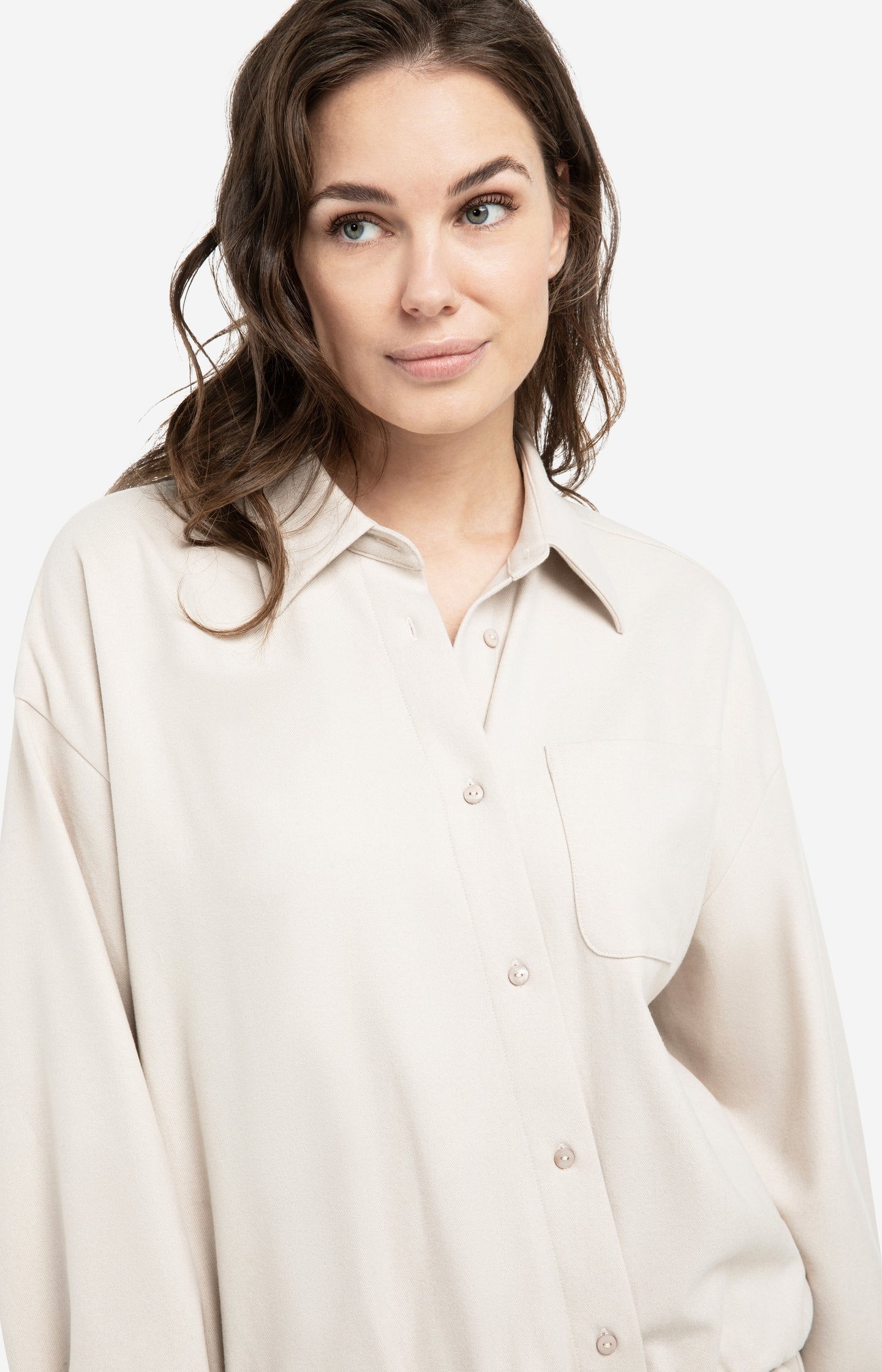 Blouse with asymmetric button placket and elastic hem