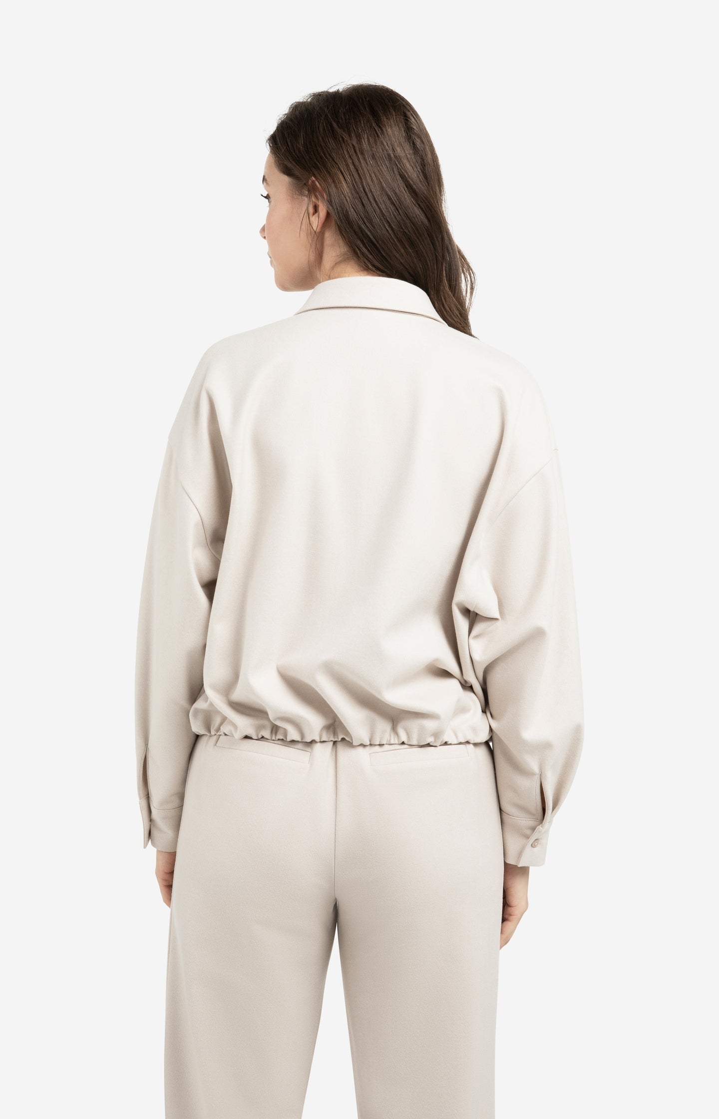 Blouse with asymmetric button placket and elastic hem